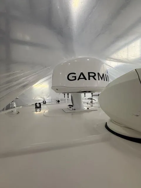 Slide: The Image of 2015 Sailfish 290 CC boat with Garmin radar under protective cover. - 9