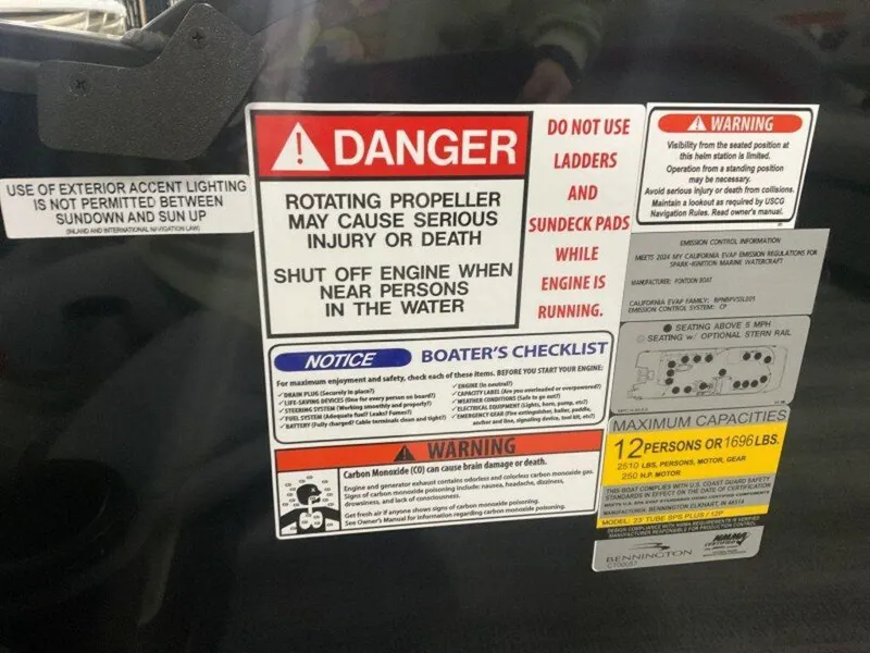 Slide: The Image of Safety warning labels on a 2025 Bennington 24MLSE boat, highlighting propeller danger and capacity limits. - 12