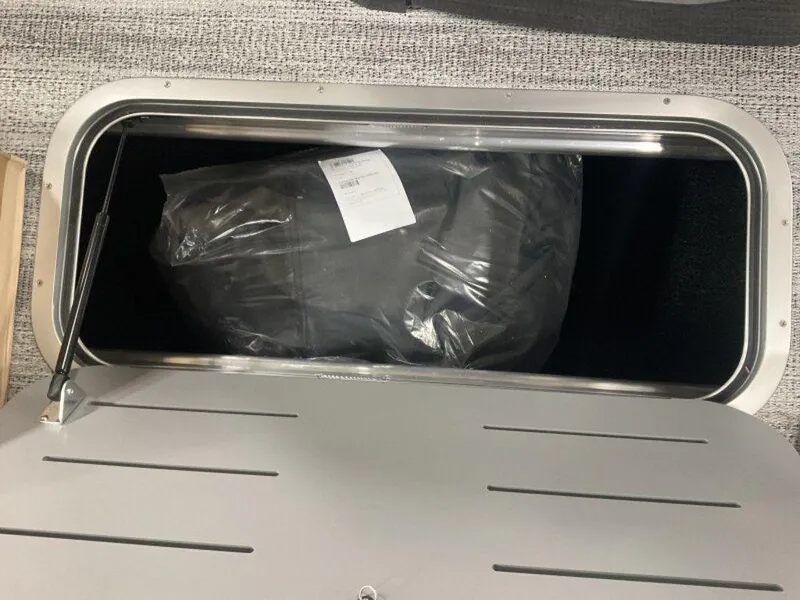 Slide: The Image of Storage compartment of 2025 Bennington 24MLSE boat with packaged item inside. - 13