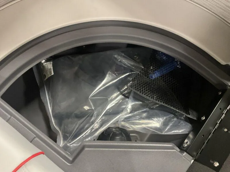 Slide: The Image of Storage compartment of 2025 Bennington 24MLSE boat with protective cover and netting. - 14