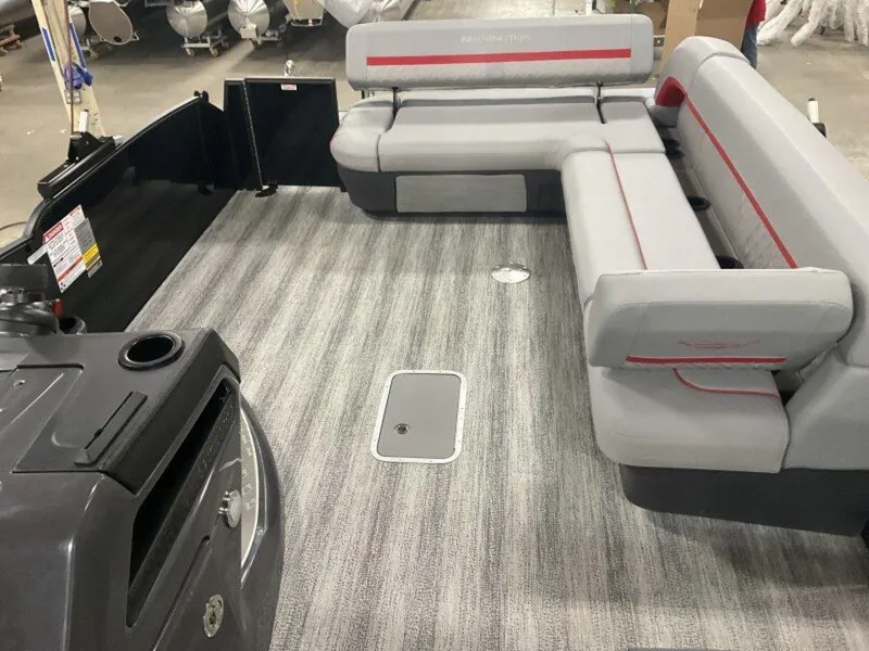 Slide: The Image of 2025 Bennington 24MLSE pontoon boat interior with gray seating and striped flooring. - 6