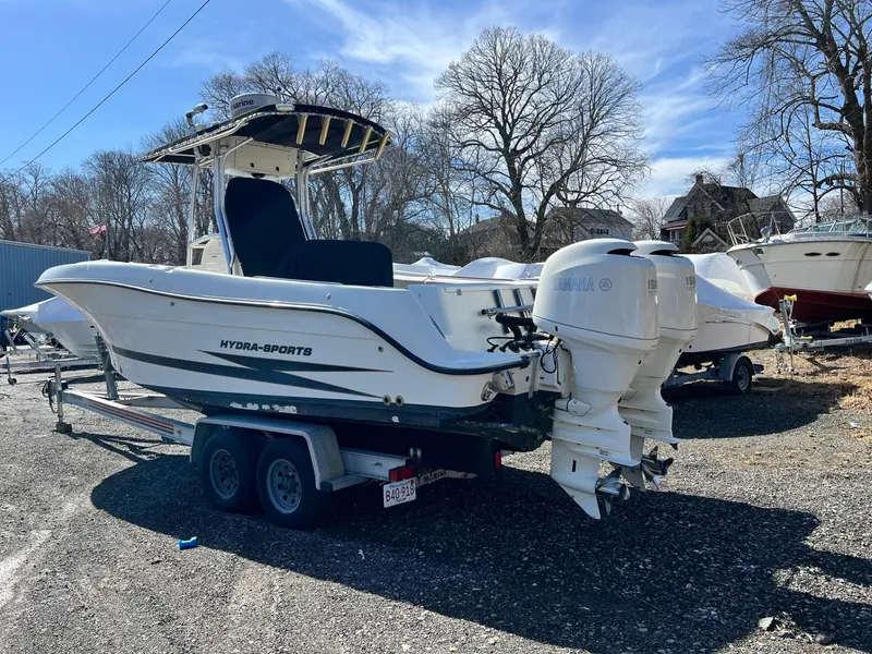 Slide: The Image of 2006 Hydra-Sports Vector 2500 CC boat on trailer, parked outdoors. - 2