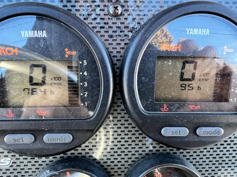 Slide: The Image of Yamaha tachometers on a 2006 Hydra-Sports Vector 2500 CC boat dashboard. - 3
