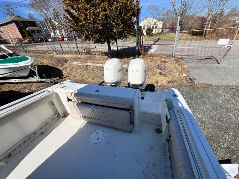 Slide: The Image of 2006 Hydra-Sports Vector 2500 CC boat with dual engines, parked outdoors. - 5