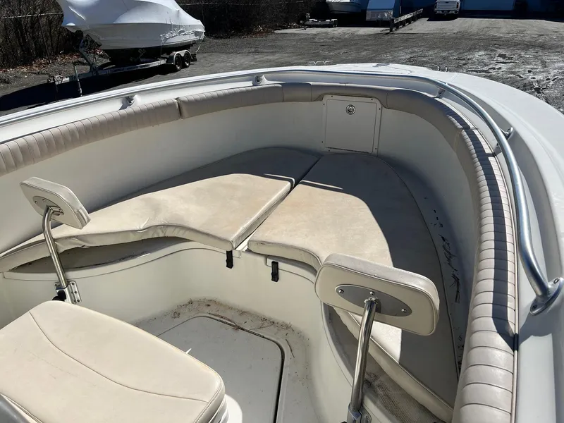 Slide: The Image of 2006 Hydra-Sports Vector 2500 CC boat interior with cushioned seating and storage. - 6