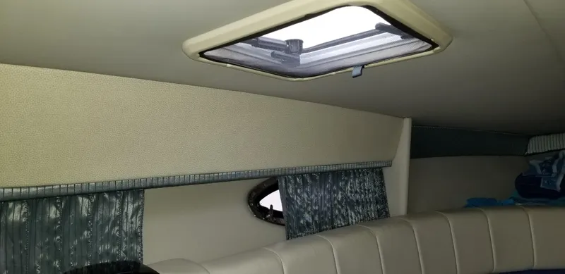 Slide: The Image of Interior cabin of a 2006 Formula 330 SS boat with skylight and curtains. - 13