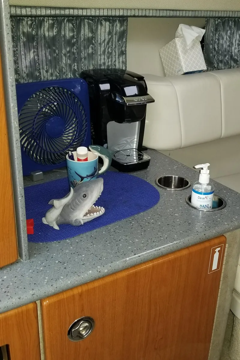 Slide: The Image of 2006 Formula 330 SS cabin with coffee maker, fan, and shark toy on counter. - 15