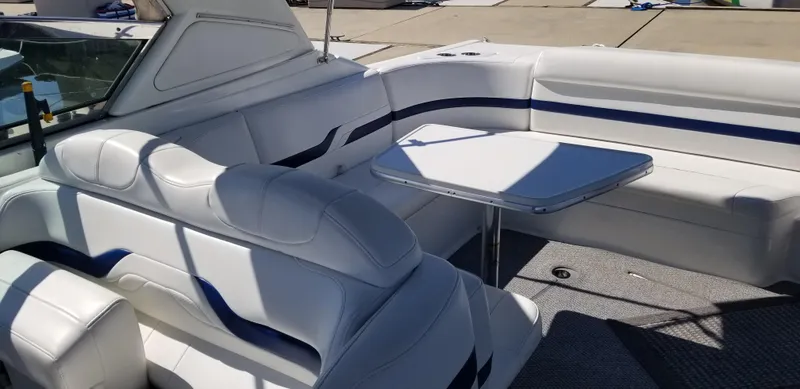 Slide: The Image of 2006 Formula 330 SS boat interior with white seating and table. - 5