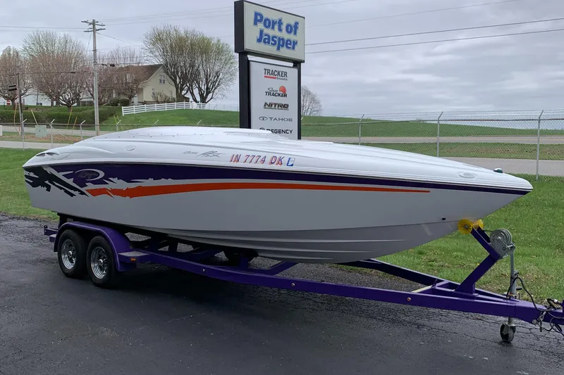 Slide: The Image of 2003 Baja 24 H2X Boss speedboat on trailer at Port of Jasper. - 1