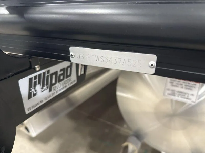 Slide: The Image of 2025 Bennington SX L-Bench 23 SXL with visible serial number plate. - 13