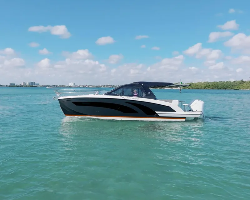 Slide: The Image of 2025 Hanover 387 boat cruising on a sunny day with clear blue skies. - 1