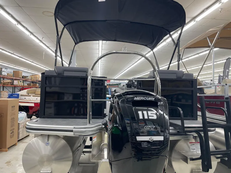 Slide: The Image of 2025 Lowe LS230W pontoon boat with Mercury 115 engine in showroom. - 7