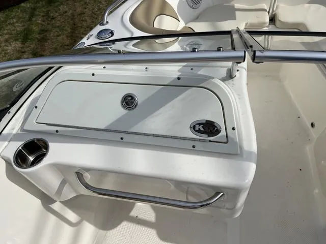 Slide: The Image of 2018 Key West 186DC boat interior with storage compartment and seating area. - 10