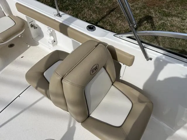 Slide: The Image of 2018 Key West 186DC boat seat with beige and white upholstery. - 12