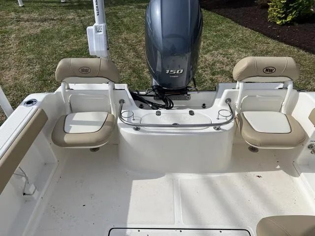 Slide: The Image of 2018 Key West 186DC boat interior with seating and outboard motor. - 13