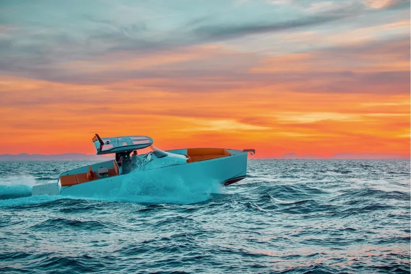 Slide: The Image of 2024 Tesoro T40 Inboard yacht cruising at sunset on open sea. - 14