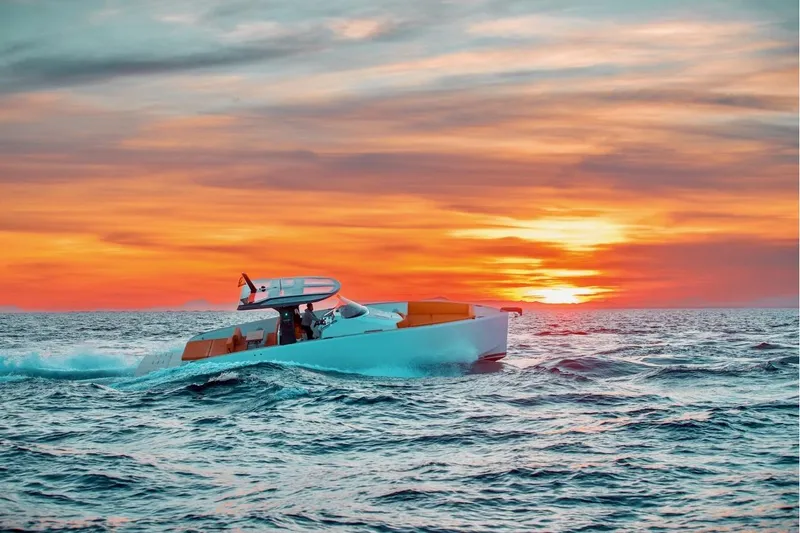 Slide: The Image of 2024 Tesoro T40 Inboard cruising at sunset on the ocean. - 15