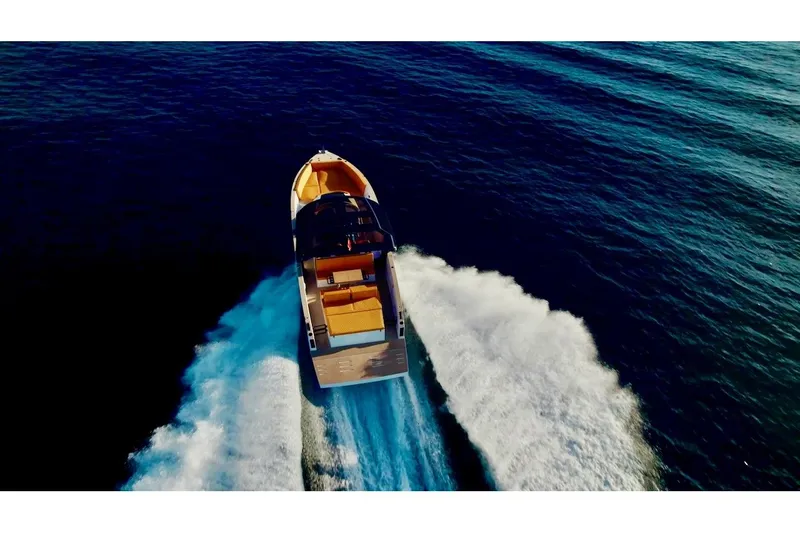 Slide: The Image of 2024 Tesoro T40 Inboard cruising on open water, aerial view. - 16