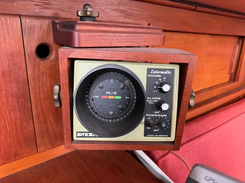 Slide: The Image of Vintage marine depth finder on a 1981 Bristol 29.9 sailboat, mounted in a wooden frame. - 25