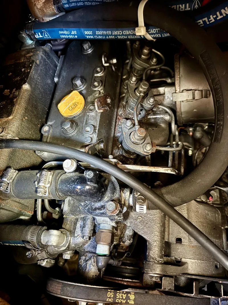 Slide: The Image of 1981 Bristol 29.9 engine close-up, showcasing mechanical components and hoses. - 27