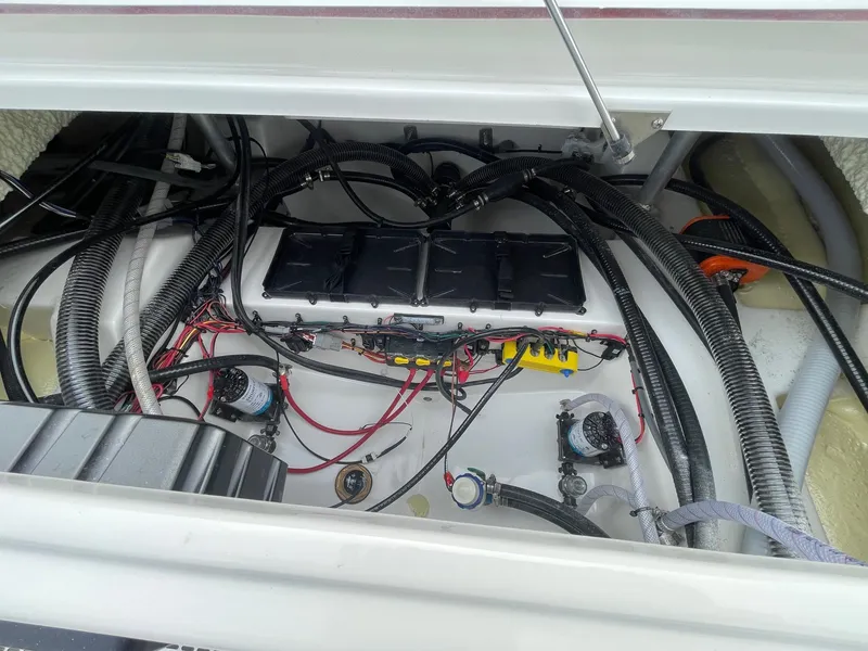 Slide: The Image of 2025 Sea Pro 245 Sandbar boat wiring and battery compartment. - 15