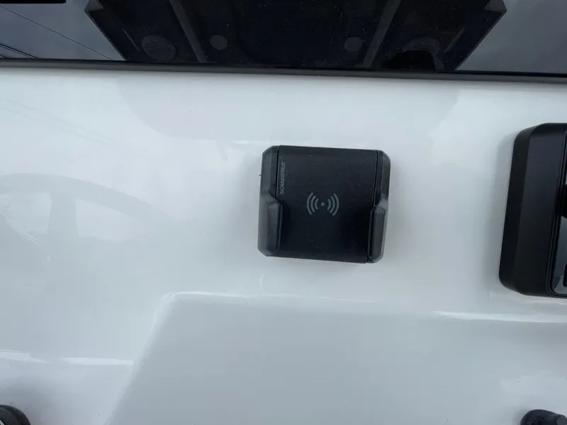 Slide: The Image of Wireless charging pad on 2025 Sea Pro 245 Sandbar boat dashboard. - 18