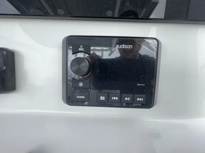 Slide: The Image of Audio control panel on 2025 Sea Pro 245 Sandbar boat dashboard. - 20