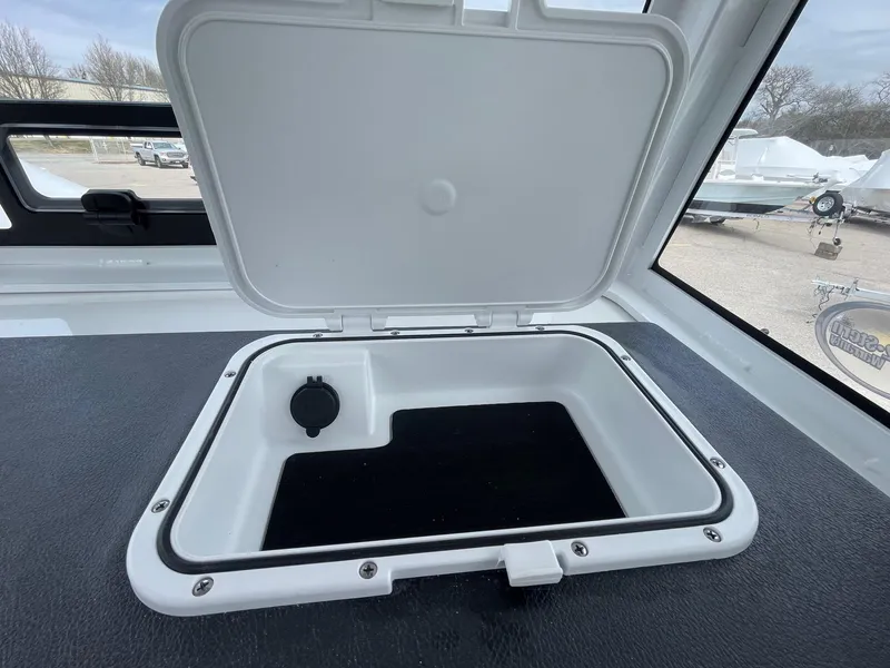 Slide: The Image of Open storage compartment on 2025 Sea Pro 245 Sandbar boat. - 24
