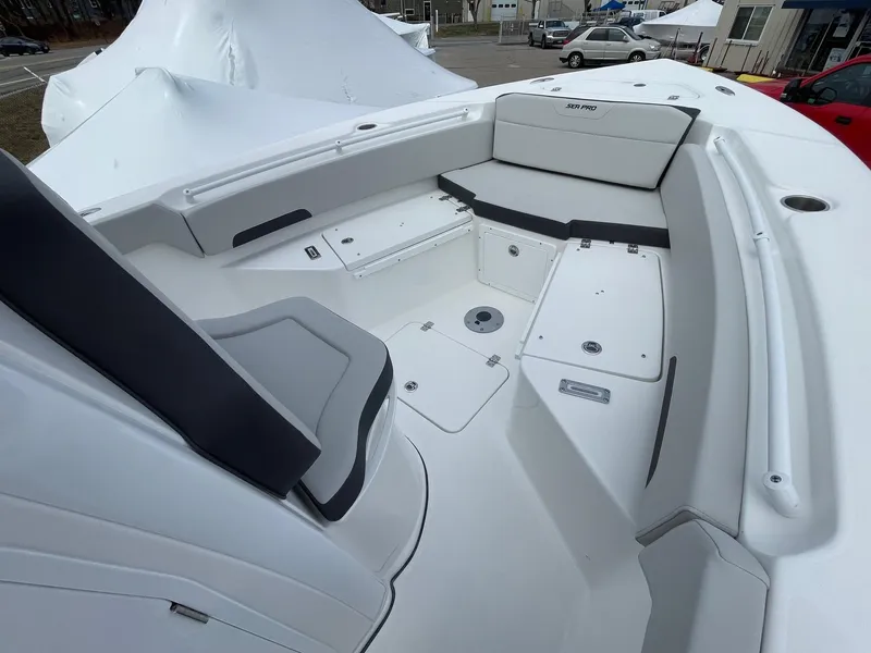 Slide: The Image of 2025 Sea Pro 245 Sandbar boat interior with cushioned seating and storage compartments. - 27