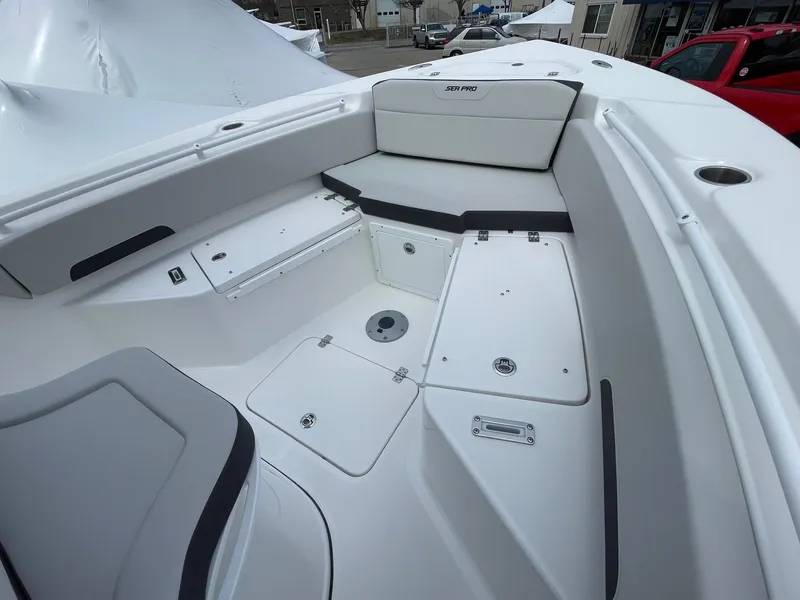 Slide: The Image of 2025 Sea Pro 245 Sandbar boat interior with sleek seating and storage compartments. - 29