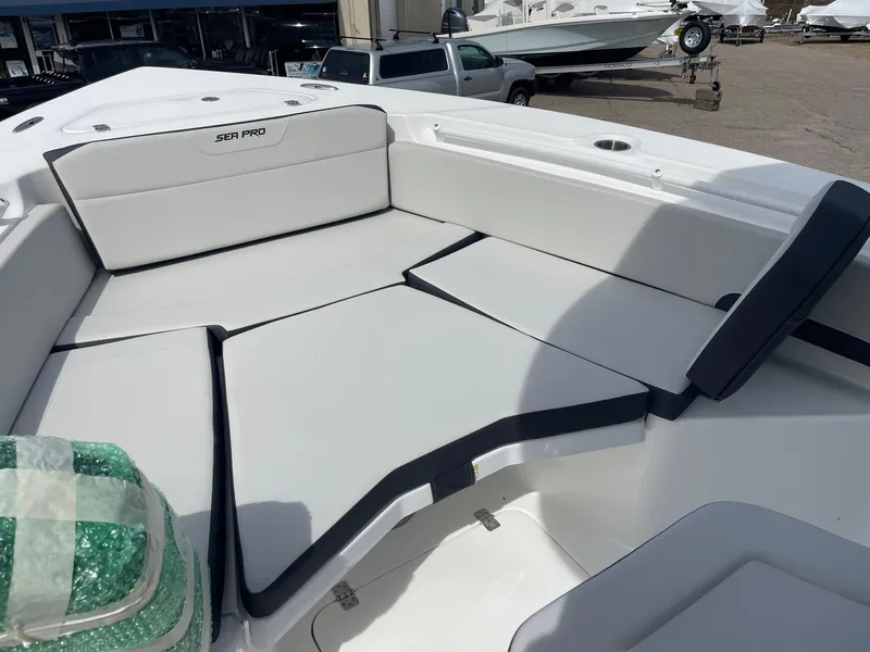 Slide: The Image of 2025 Sea Pro 245 Sandbar boat interior with cushioned seating and sleek design. - 34