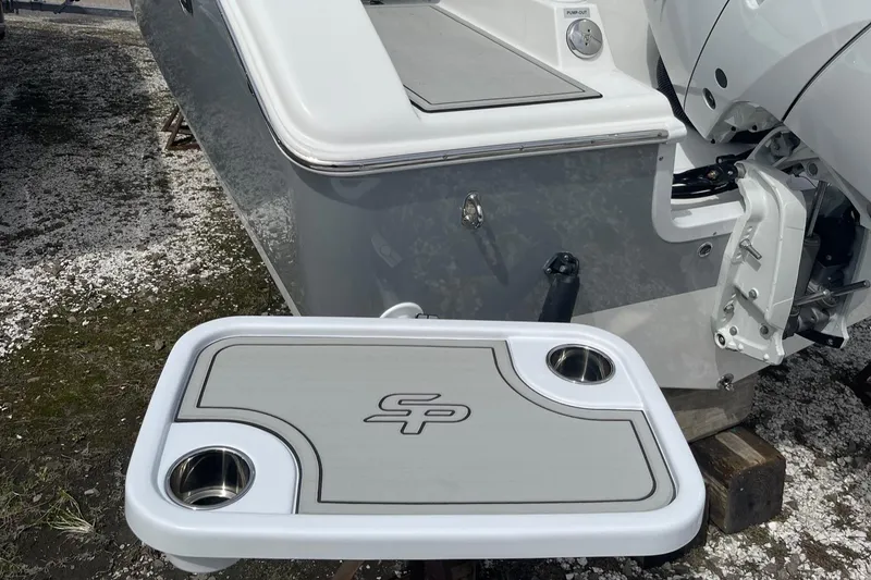 Slide: The Image of 2025 Sea Pro 245 Sandbar boat with integrated table and cup holders. - 35