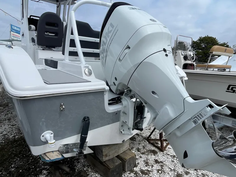 Slide: The Image of 2025 Sea Pro 245 Sandbar boat with Yamaha outboard motor, displayed on a gravel surface. - 6