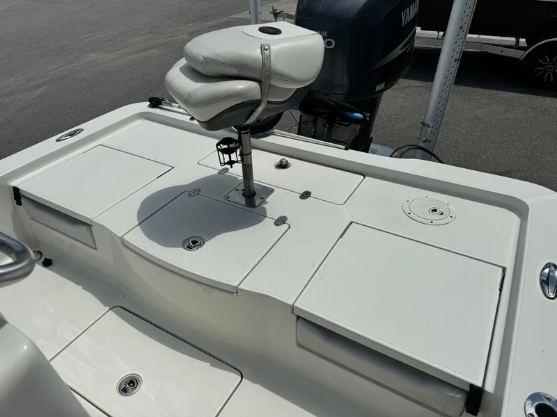 Slide: The Image of 2010 Ranger 2310 boat deck with seat and Yamaha motor in background. - 18