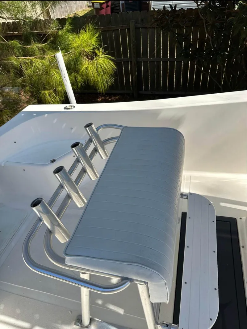 Slide: The Image of 2006 Sea King 210CC boat with rod holders and cushioned seating. - 10