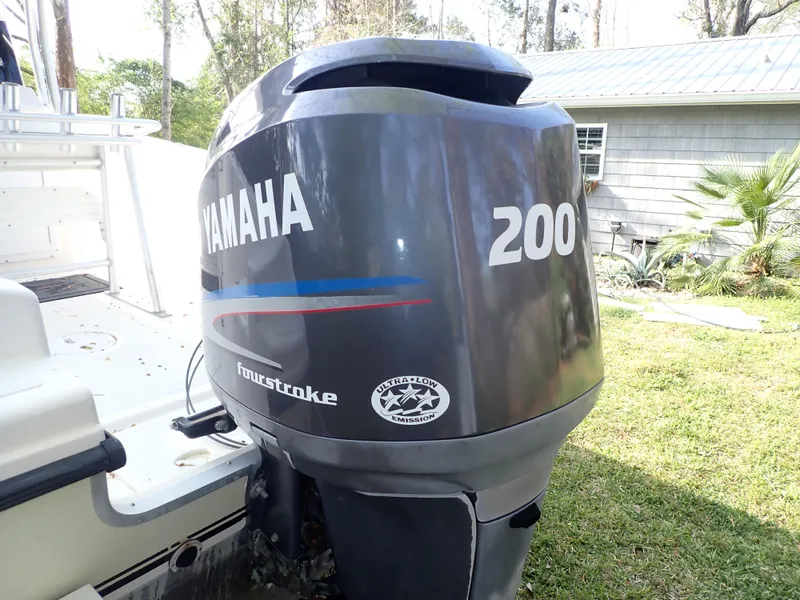 Slide: The Image of Yamaha 200 four-stroke outboard motor on a 2006 Sea King 210CC boat. - 14