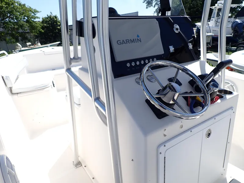 Slide: The Image of 2006 Sea King 210CC boat console with Garmin navigation system and steering wheel. - 3