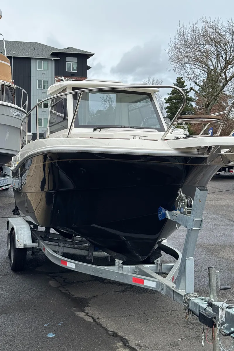Slide: The Image of 2022 Oceania 23WA boat on trailer, parked outdoors. - 12