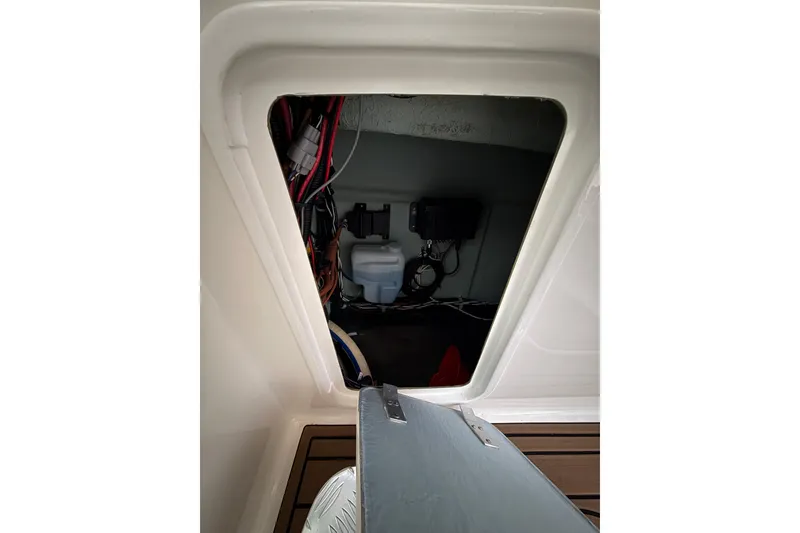 Slide: The Image of Interior view of 2022 Oceania 23WA boat compartment with wiring and equipment. - 15