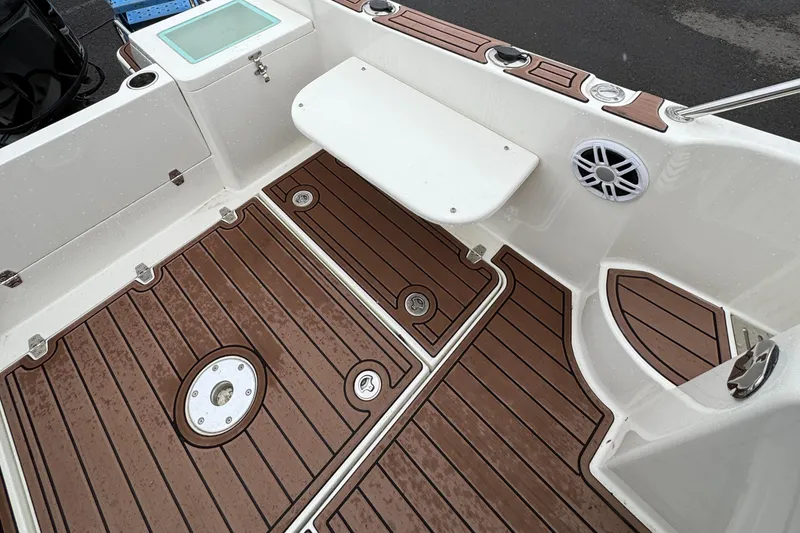 Slide: The Image of Oceania 23WA 2022 boat deck with wood finish and seating area. - 4