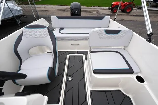 Slide: The Image of 2025 Bayliner Element M19 boat interior with modern seating and sleek design. - 21