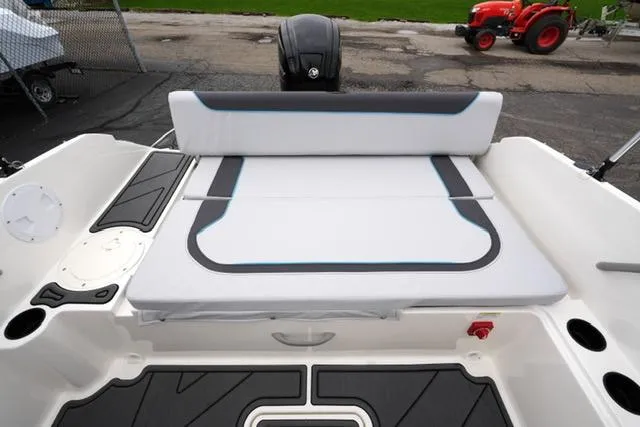 Slide: The Image of 2025 Bayliner Element M19 boat interior with cushioned seating and modern design. - 22