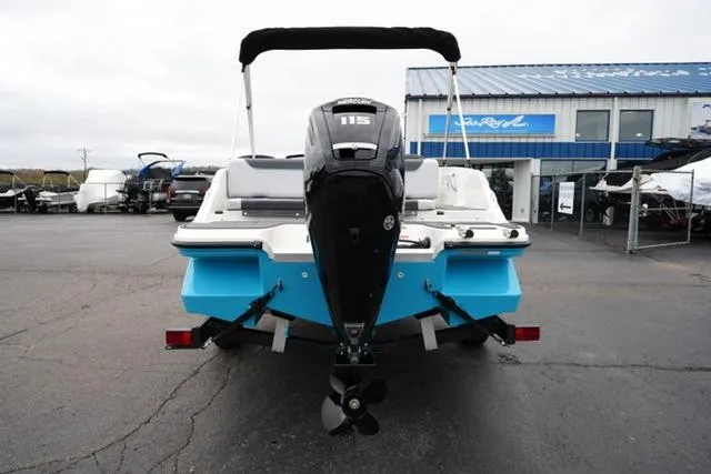 Slide: The Image of 2025 Bayliner Element M19 boat with outboard motor, displayed at a dealership. - 5