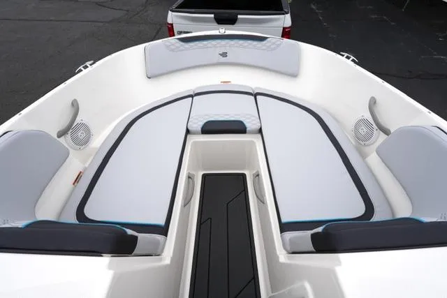 Slide: The Image of 2025 Bayliner Element M19 boat interior with cushioned seating and modern design. - 7