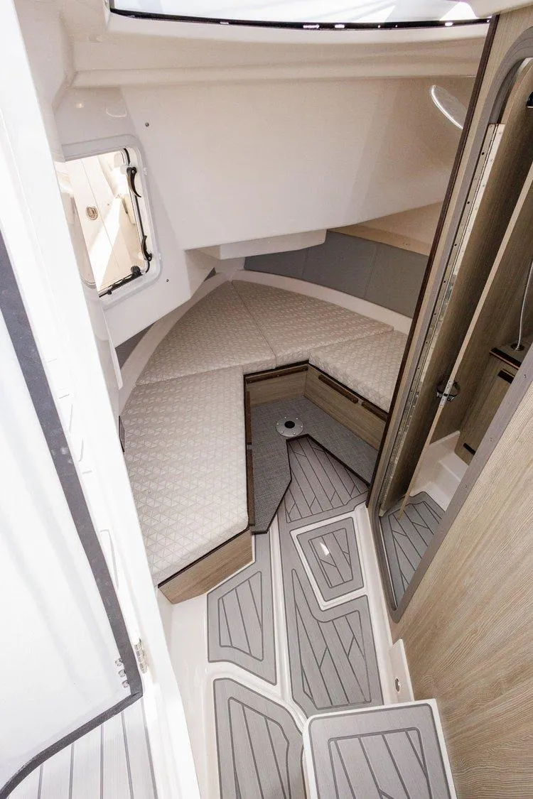 Slide: The Image of Interior of 2026 Solara S 310 SB boat, featuring modern design and comfortable seating. - 15