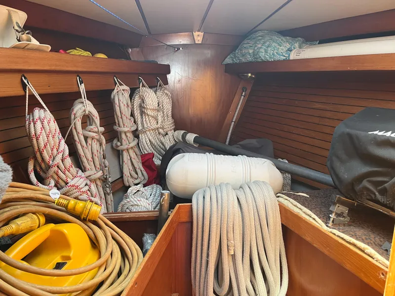 Slide: The Image of Interior of 1982 Baltic 42 sailboat with ropes and nautical equipment neatly stored. - 18