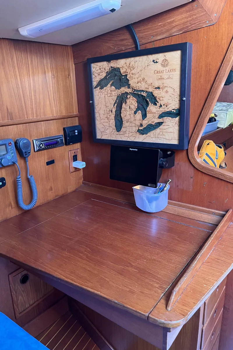 Slide: The Image of Navigation station on 1982 Baltic 42 sailboat with Great Lakes map and communication equipment. - 19