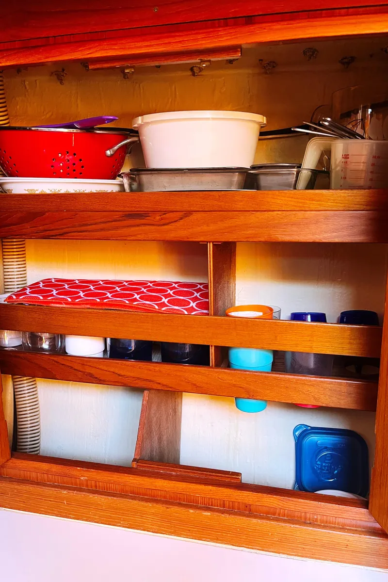 Slide: The Image of Wooden kitchen shelf with dishes and containers on a 1982 Baltic 42 yacht. - 42