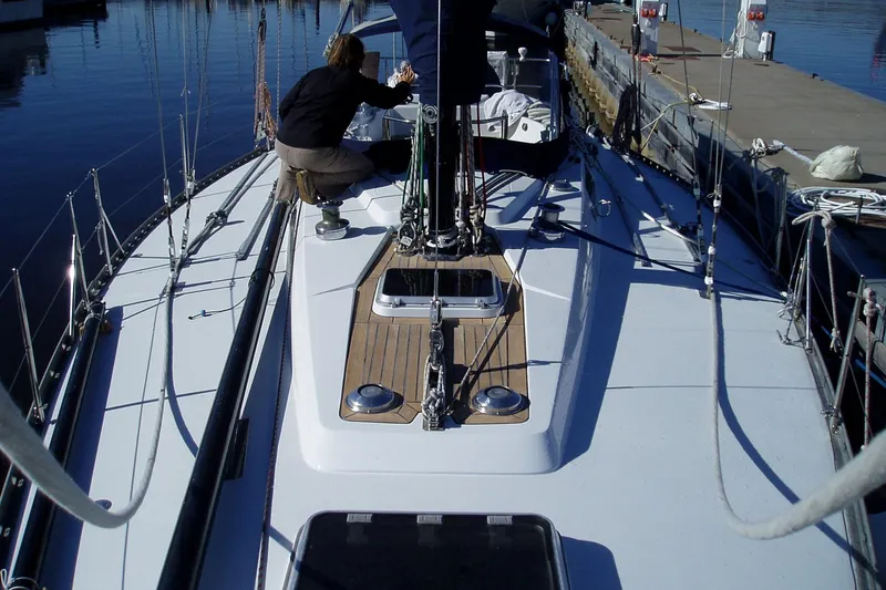 Slide: The Image of Sailing yacht Baltic 42, 1982 model, docked with person adjusting rigging. - 5