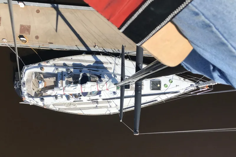 Slide: The Image of Sailing yacht Baltic 42 (1982) on a scenic lake with lush green hills. - 1